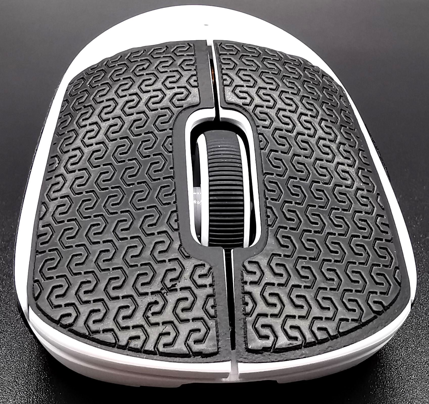 Image of a white Logitech G PRO X SUPERLIGHT with Corepad Soft Grips installed. The mouse is facing toward the camera.