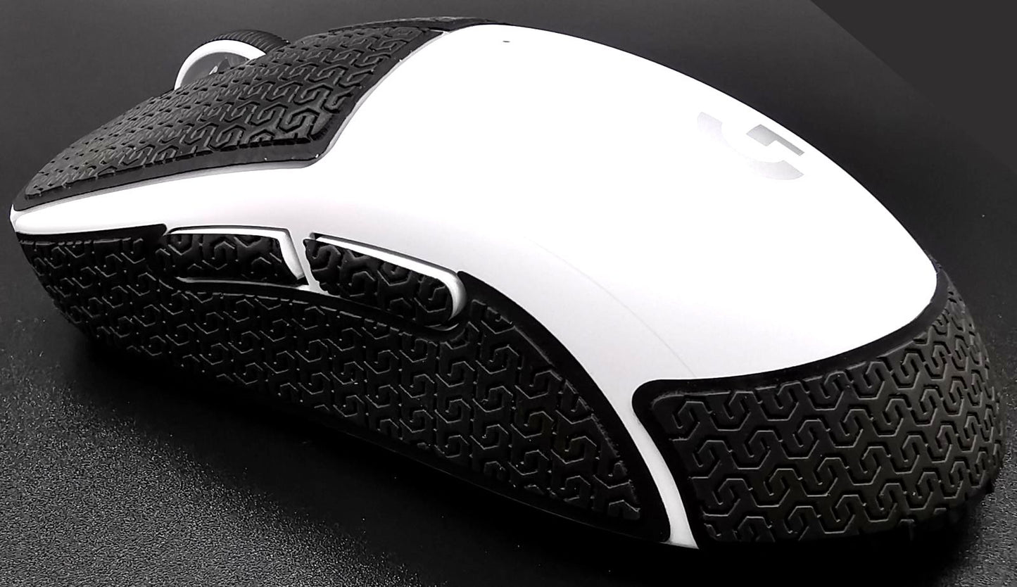 Image of a white Logitech G PRO X SUPERLIGHT with Corepad Soft Grips installed. The mouse is facing to the left..